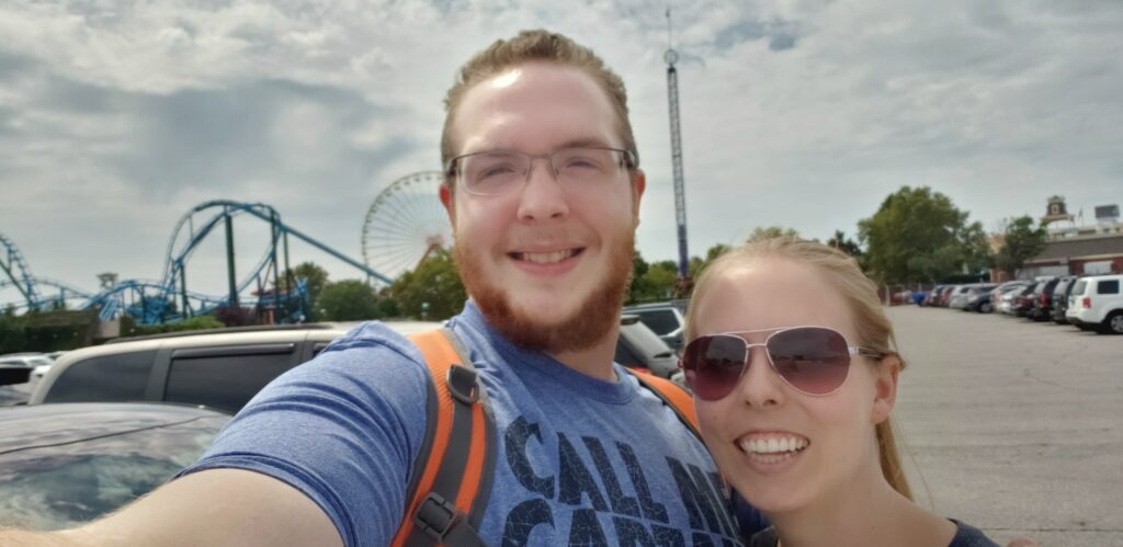 A man and woman at an amusement park dairy free and gluten free travel