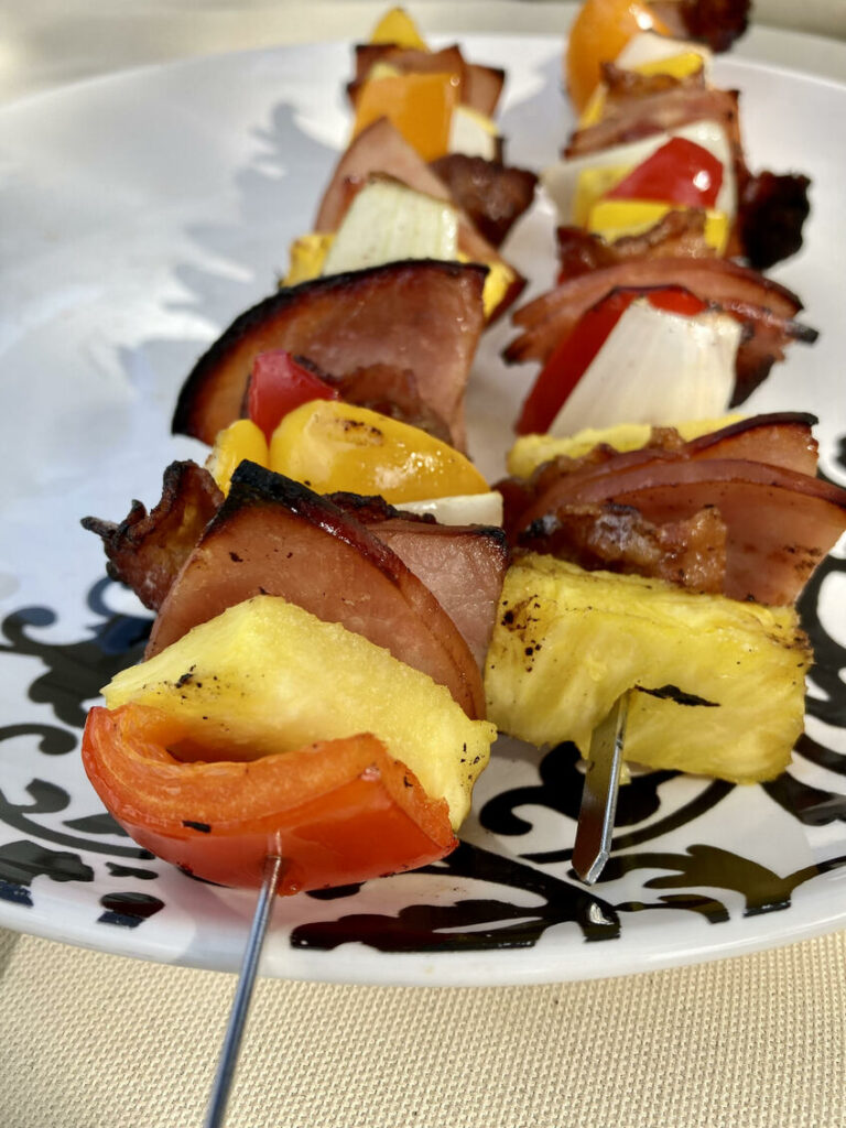 Paleo Hawaiian Skewers with ham, pineapple, bell peppers, and more on a plate
