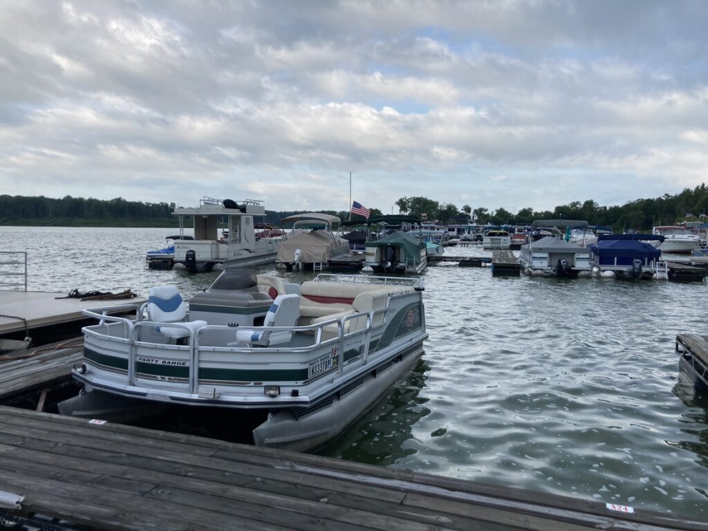 Salamonie Lake Marina with a pontoon boat in the foreground and other boats in the background