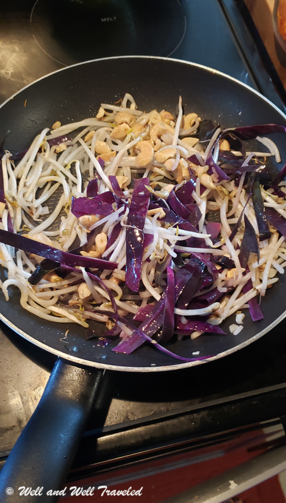 Purple Cabbage, bean sprouts, and cashews cooking