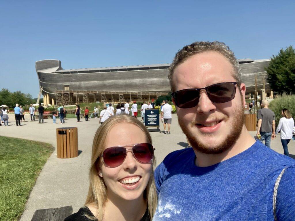 A couple standing outside of the ark