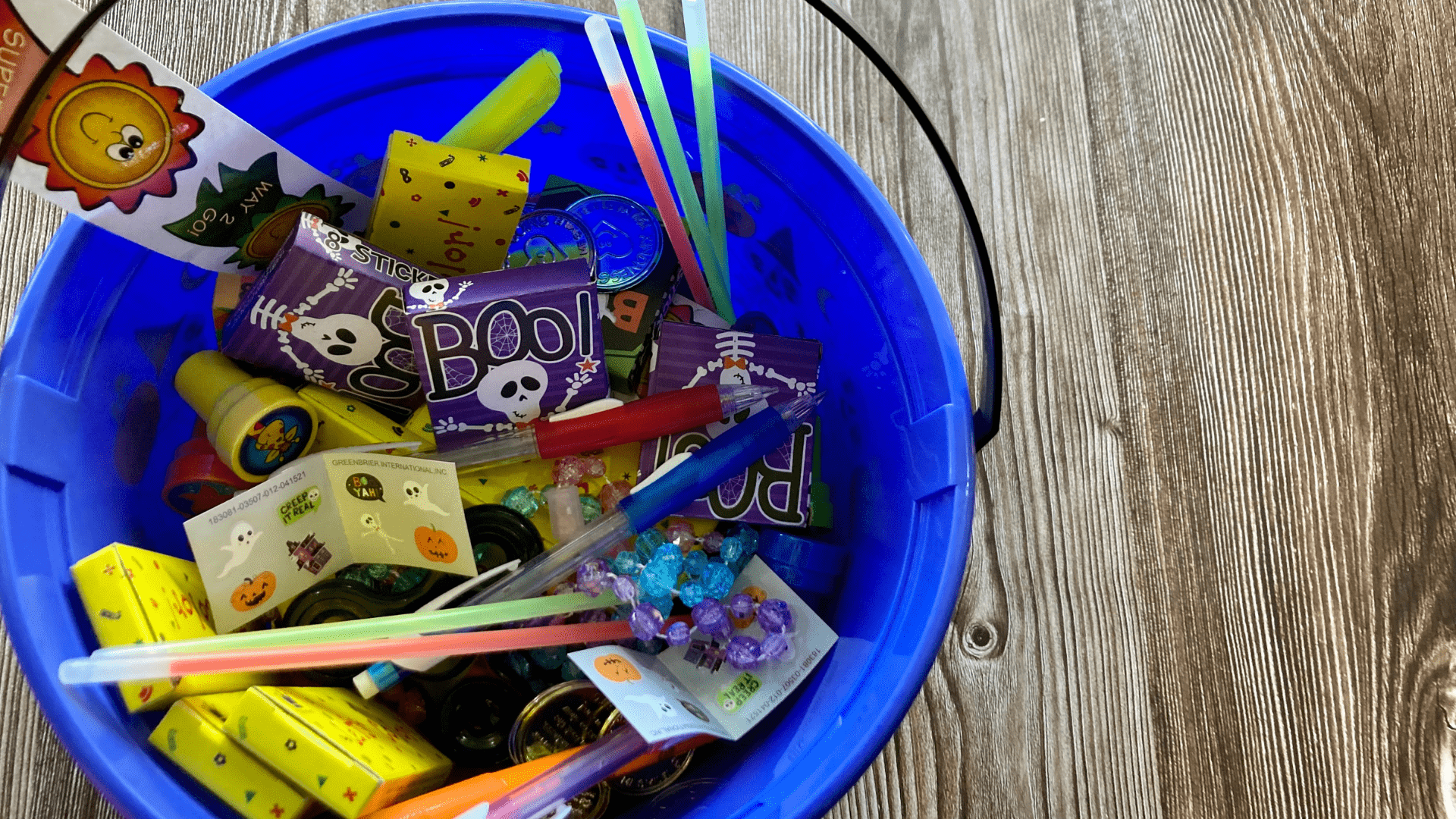 Trick-or-Treat Bucket with Non-candy Ideas like stickers, glow sticks, pencils, stamps, and more