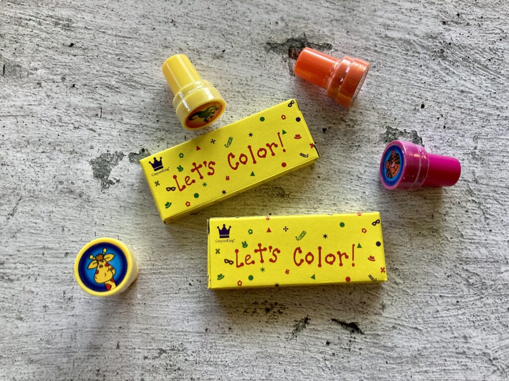 Stamps and packs of crayons are some non-candy Halloween ideas