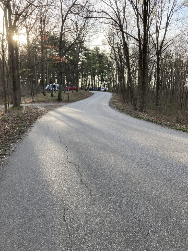 A road on a ridge leading through a campground