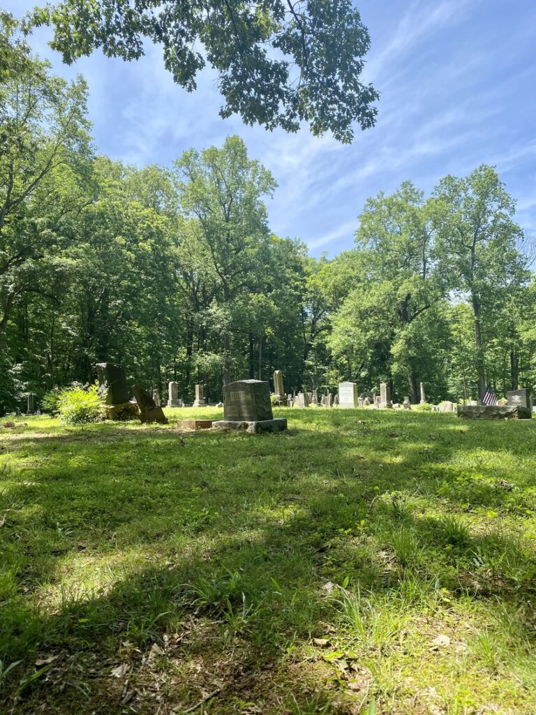 Hamer Cemetery at Spring Mill State Park in the summer.