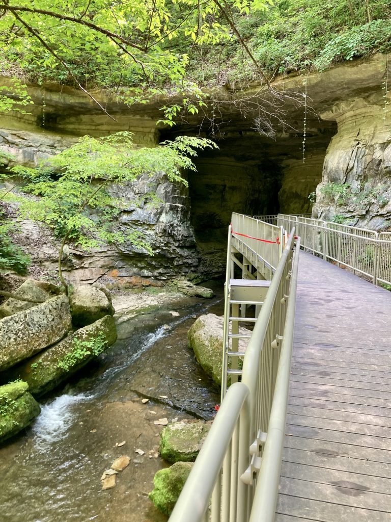 A bridge leading into Donaldson Cave at Spring Mill State Park