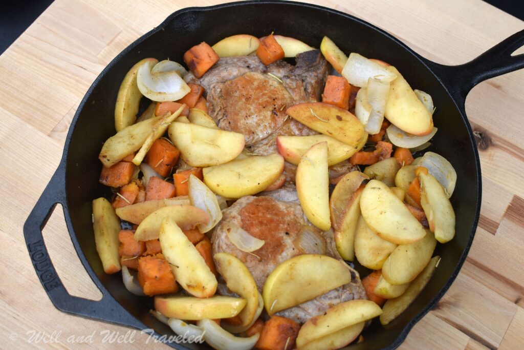 These cast iron pork chops with apples and sweet potatoes are perfect for camping!