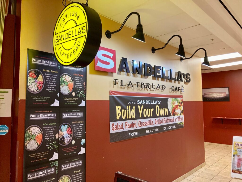 A storefront with several power bowls and gluten-free flatbread options, one of many healthy restaurants in DC