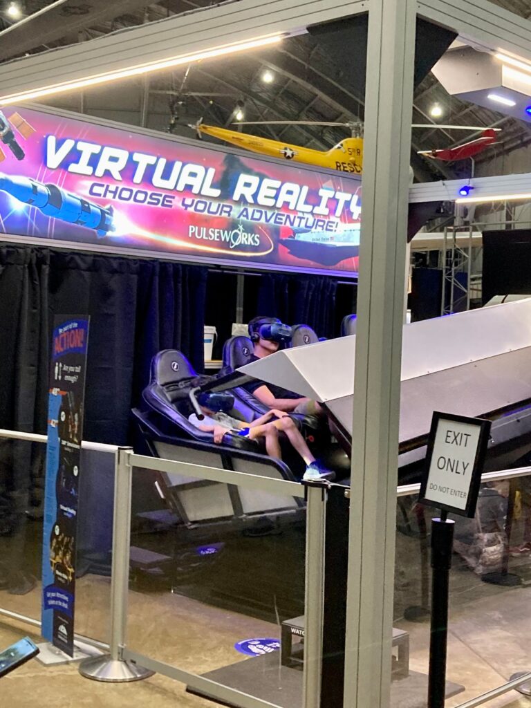 Kids playing VR rides at the National Air Force Museum
