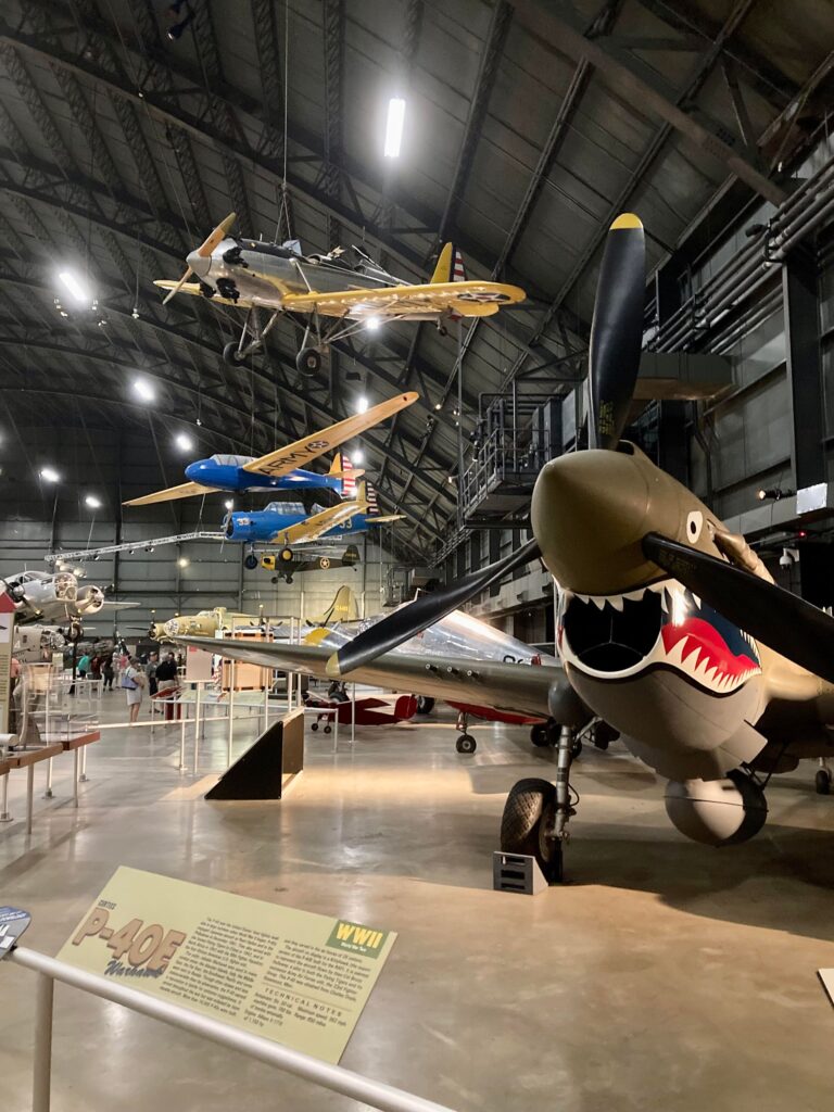 Several early military aircraft with one painted like a shark in the foreground