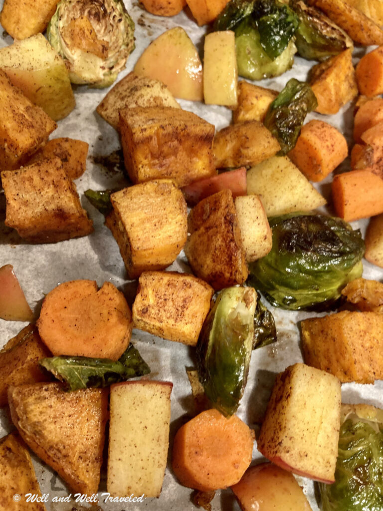 Sweet Potatoes, Apples, Brussels Sprouts, Carrots and more on a cookie sheet