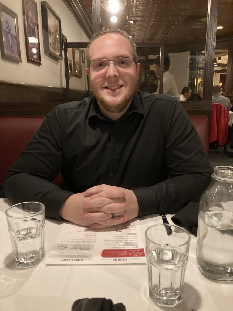 A man at Harry and Izzys, a great upscale gluten-free and dairy free restaurant in Indianapolis, IN