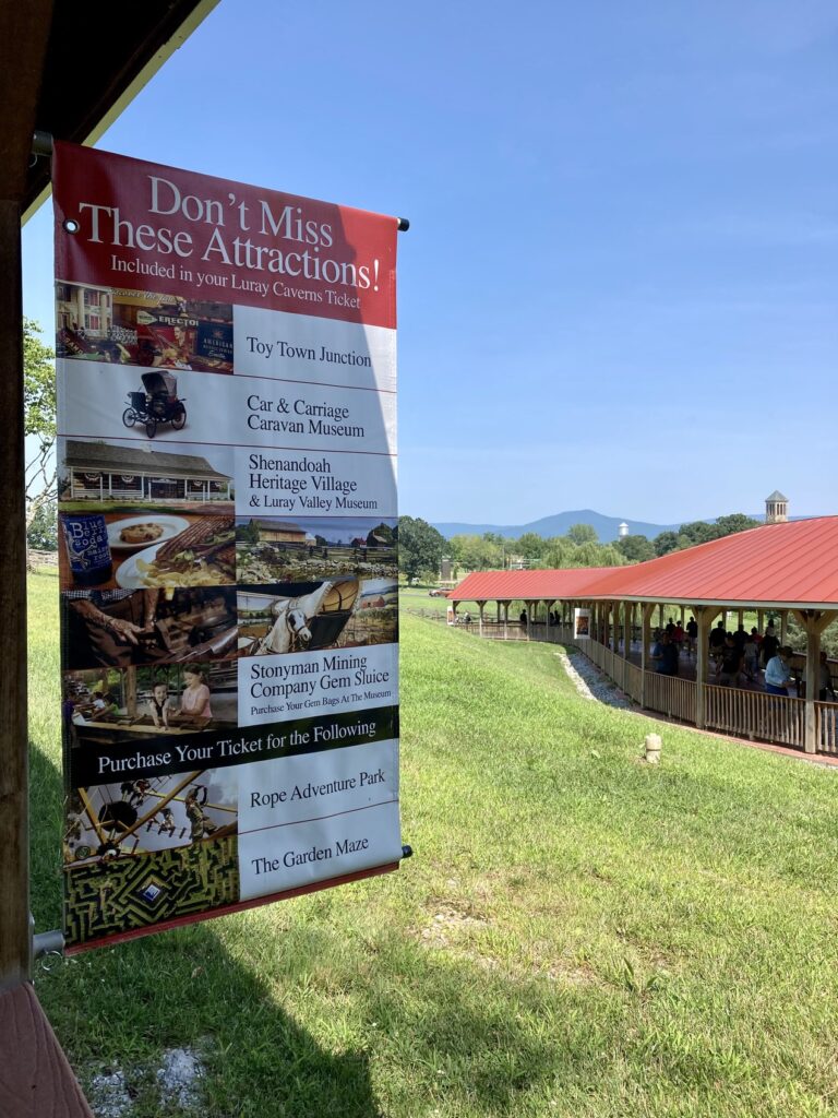 A posted list of attractions at Luray Caverns including ropes course, garden maze, and more.