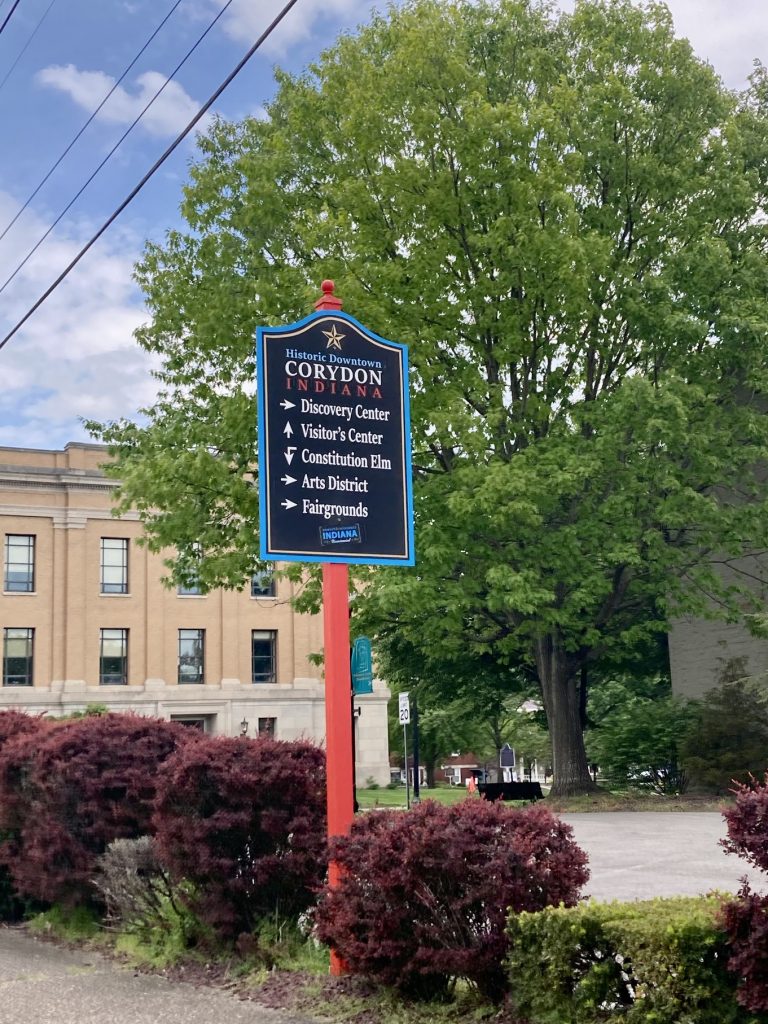 A sign for Corydon, IN listing historic sites