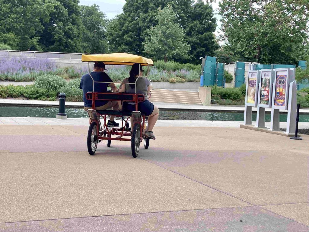 A couple who rented a bike to check out all the things to do in Indy along the canal