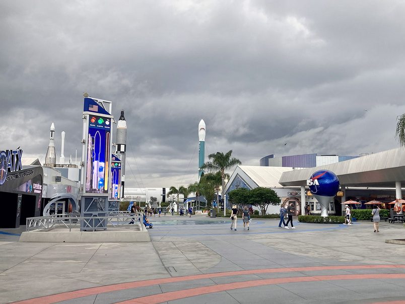People walking around the outdoors at the NASA Kennedy Space Center Complex in Florida