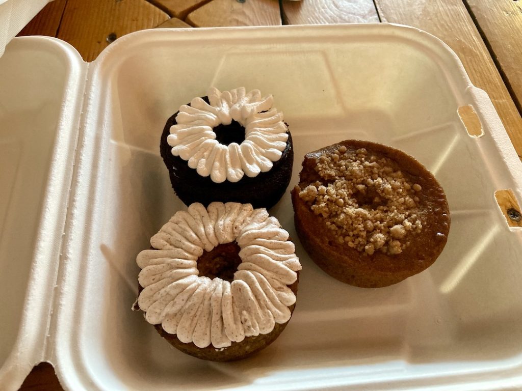 A chocolate donut, a coffee cake donut, and a banana apple donut all gluten-free and dairy-free at Bigmouth Donuts in Cleveland