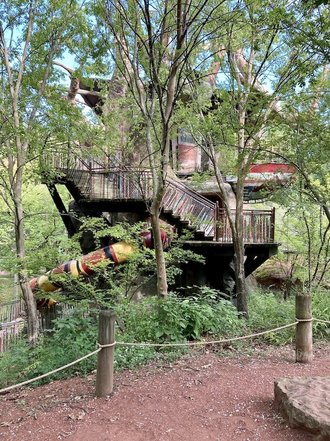 A snake slide available for kids to play on at the zoo