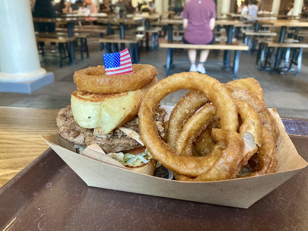 The barbecue burger and onion rings from Regal Eagle Smokehouse at Epcot