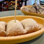 Gluten-free beignets at Disney World in a bowl with powdered sugar on top