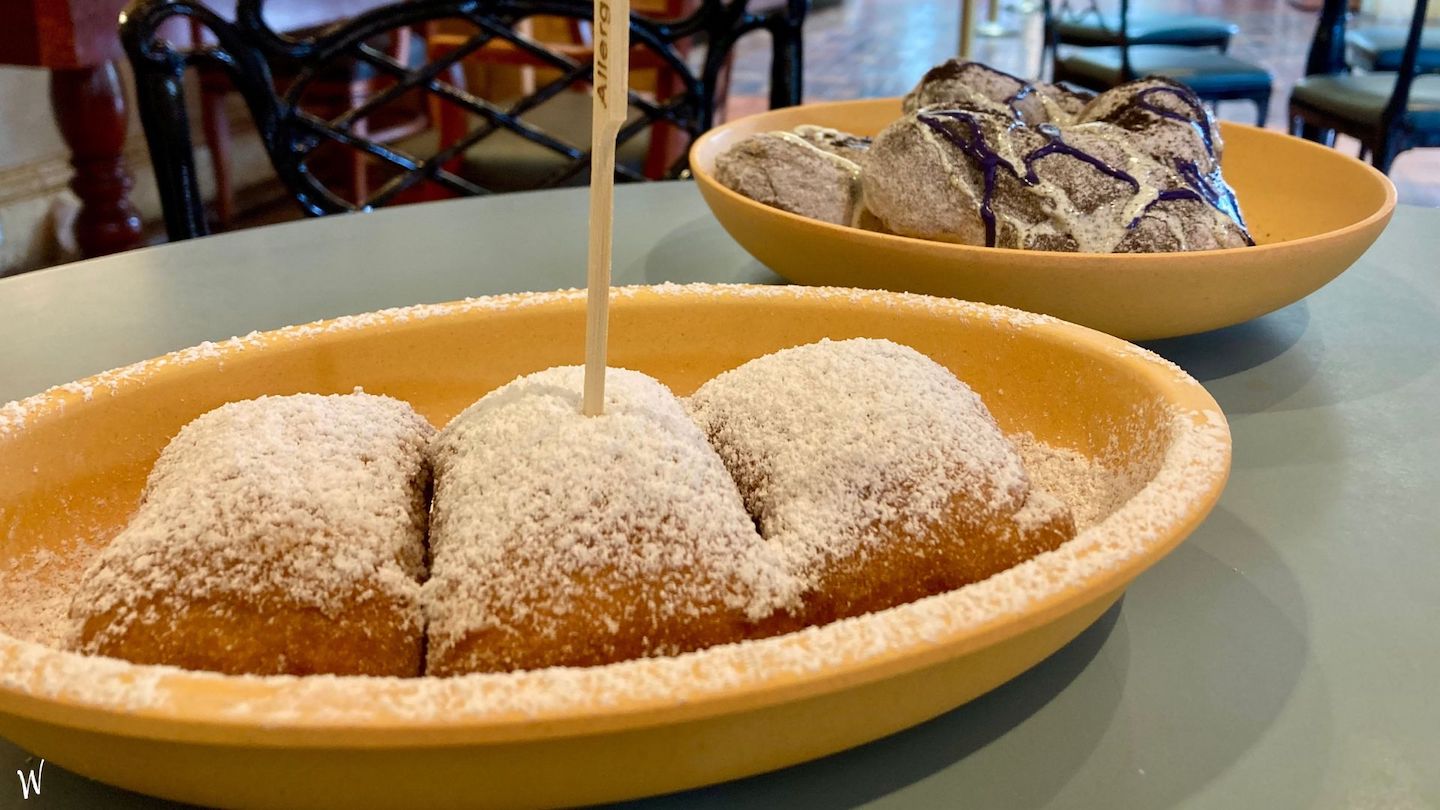 Gluten-free beignets at Disney World in a bowl with powdered sugar on top