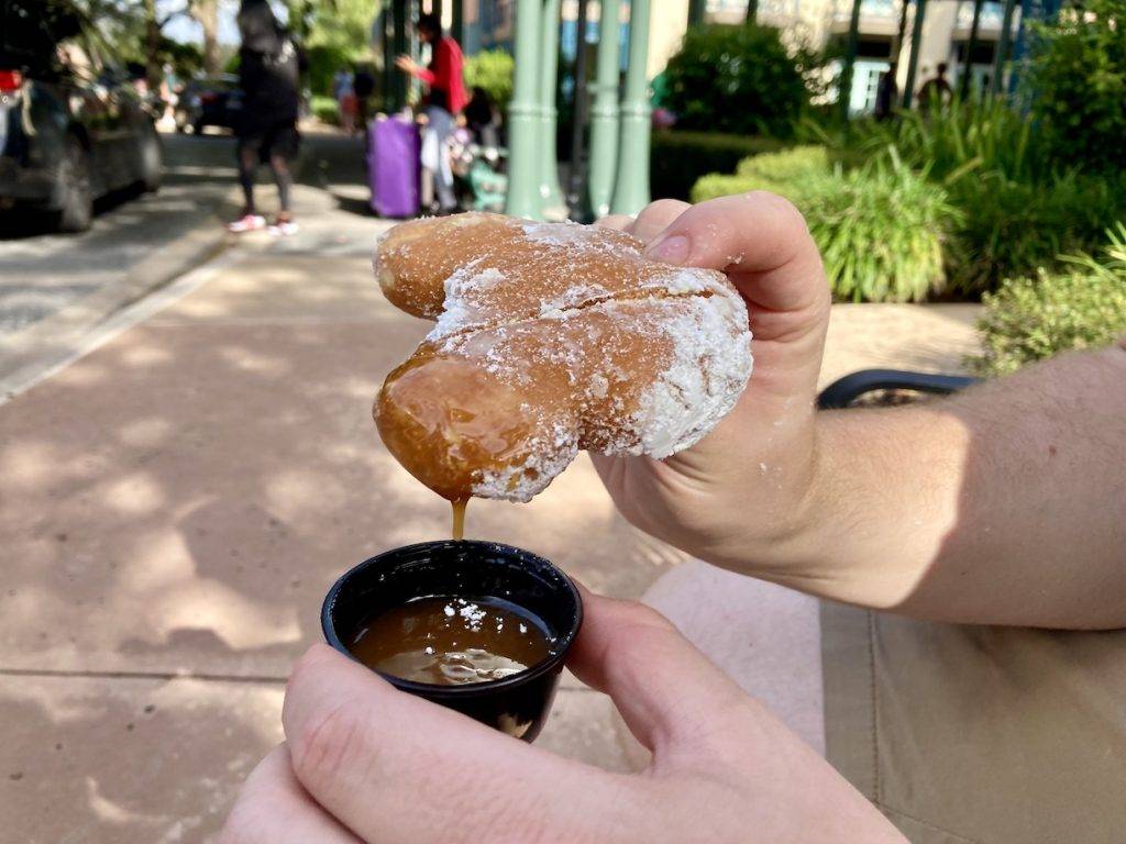 A beignet with caramel sauce at Port Orleans French Quarter